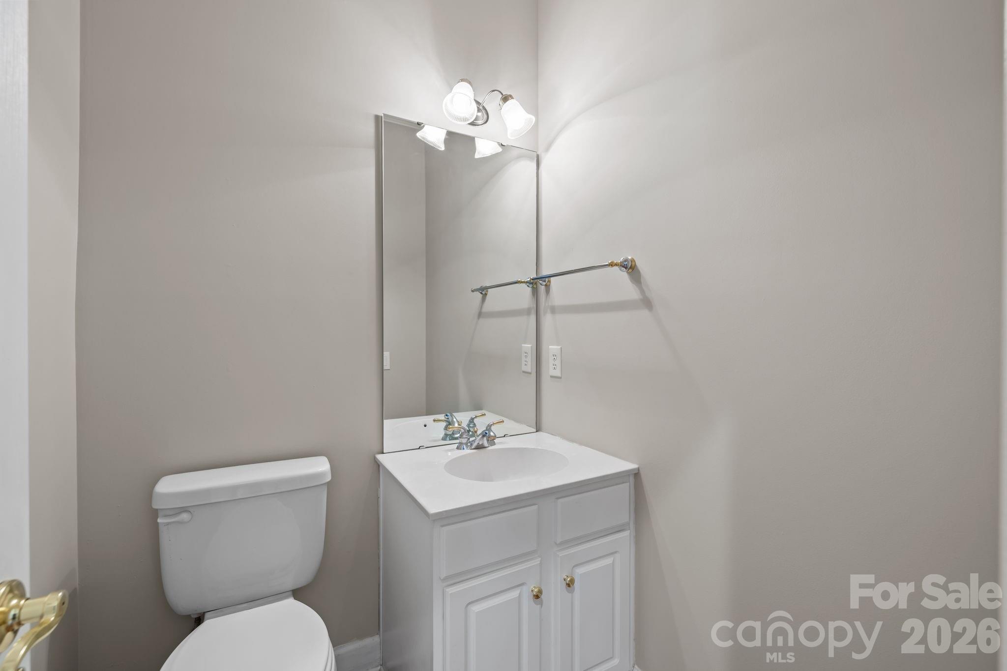 412 Eberle Way Matthews, NC 28105 - Photo 21 of 43 a bathroom with a toilet a sink and mirror