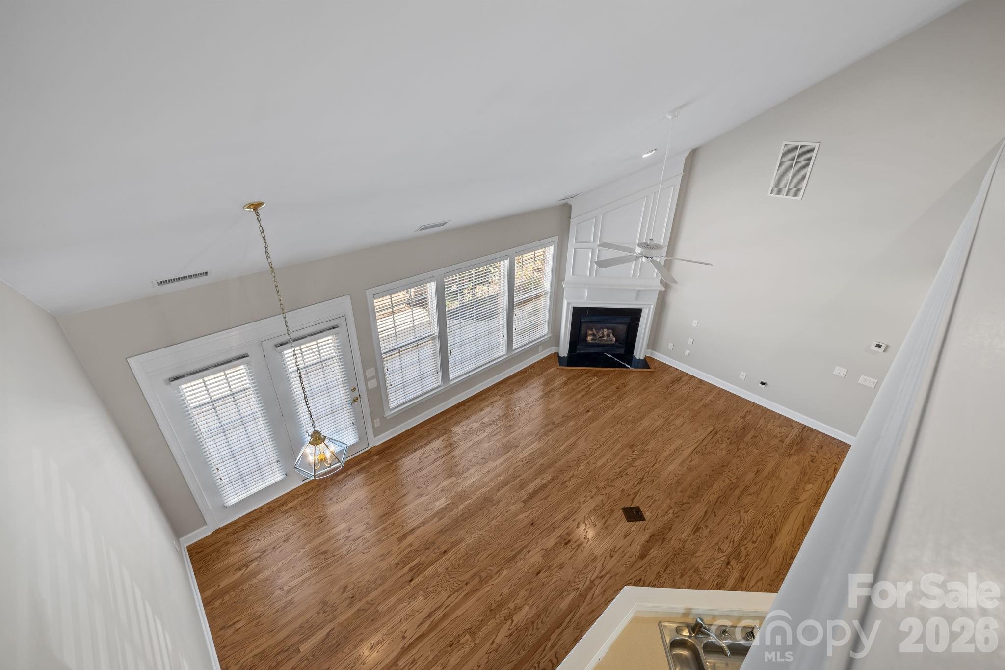 412 Eberle Way Matthews, NC 28105 - Photo 29 of 43 a view of empty room with window and fireplace