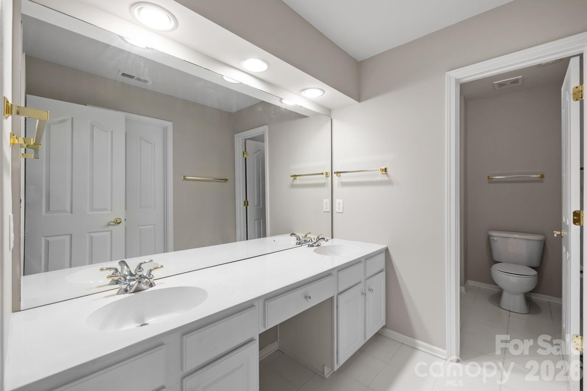 412 Eberle Way Matthews, NC 28105 - Photo 33 of 43 a bathroom with a sink and a mirror