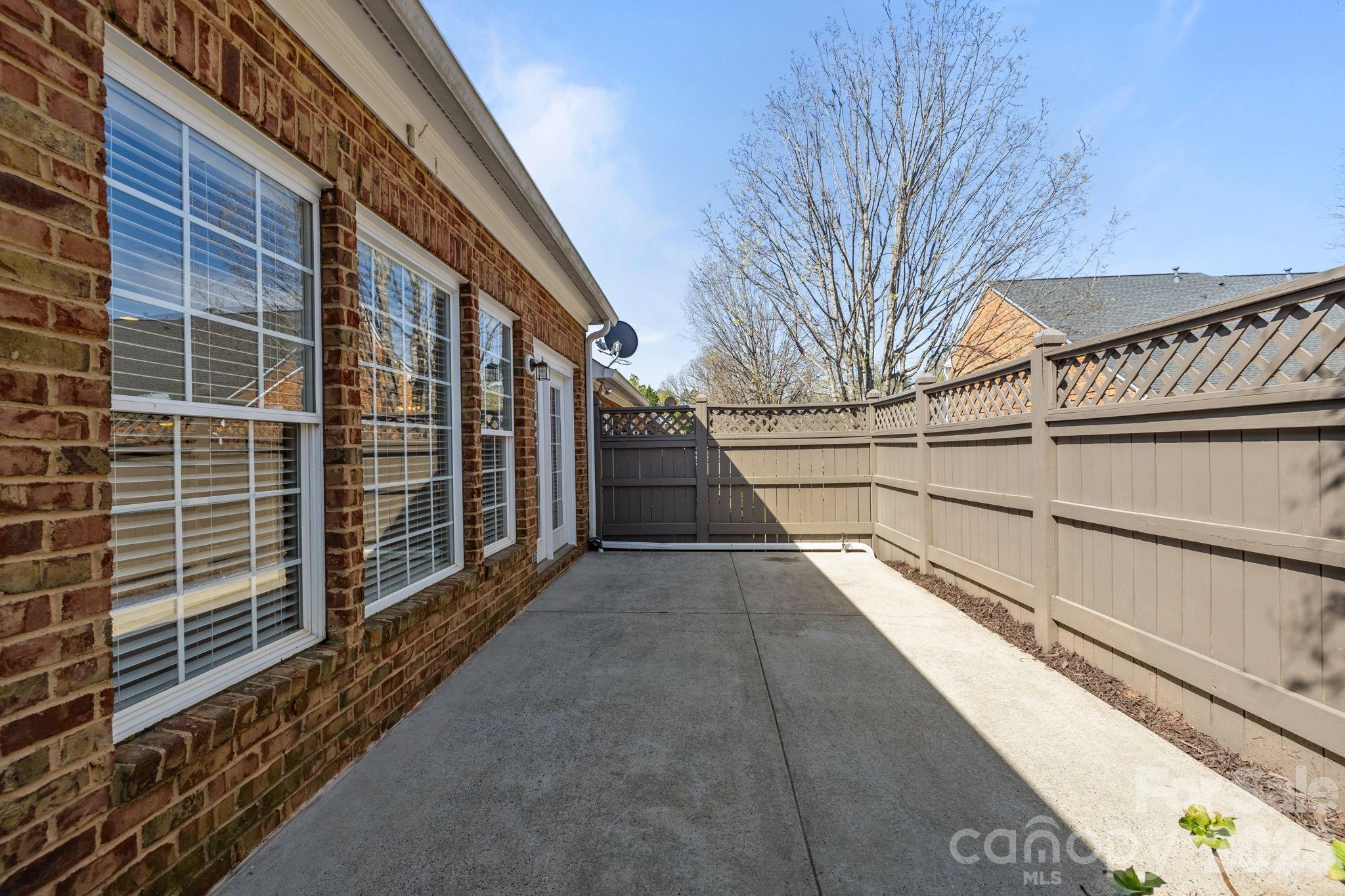 412 Eberle Way Matthews, NC 28105 - Photo 36 of 43 a view of a pathway with a building in the background