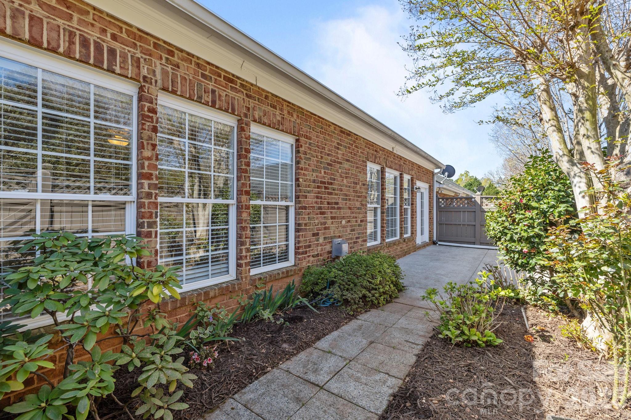 412 Eberle Way Matthews, NC 28105 - Photo 37 of 43 a house view with a garden space