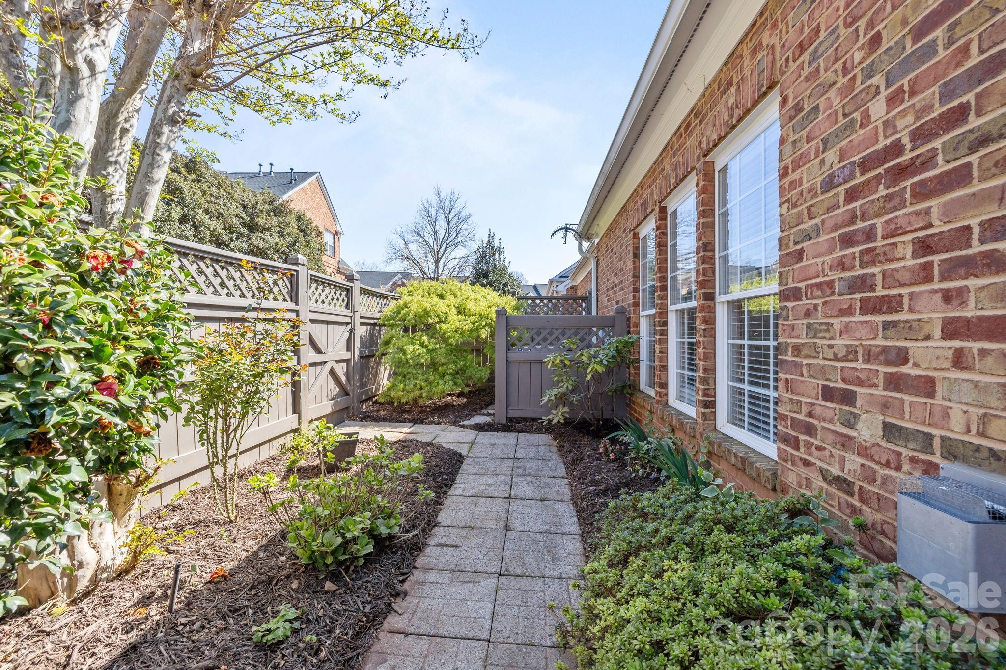 412 Eberle Way Matthews, NC 28105 - Photo 40 of 43 a pathway of a house with a yard