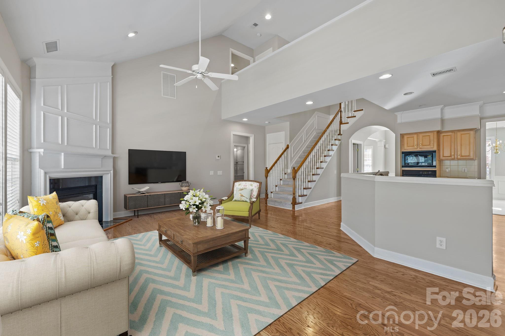 412 Eberle Way Matthews, NC 28105 - Photo 5 of 43 a living room with furniture and a flat screen tv