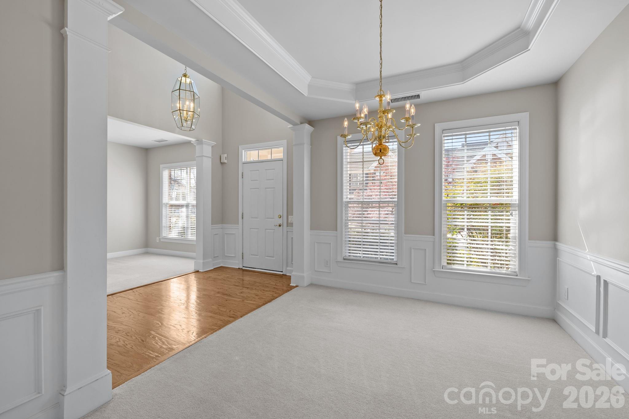 412 Eberle Way Matthews, NC 28105 - Photo 9 of 43 a view of livingroom with window and hardwood floor