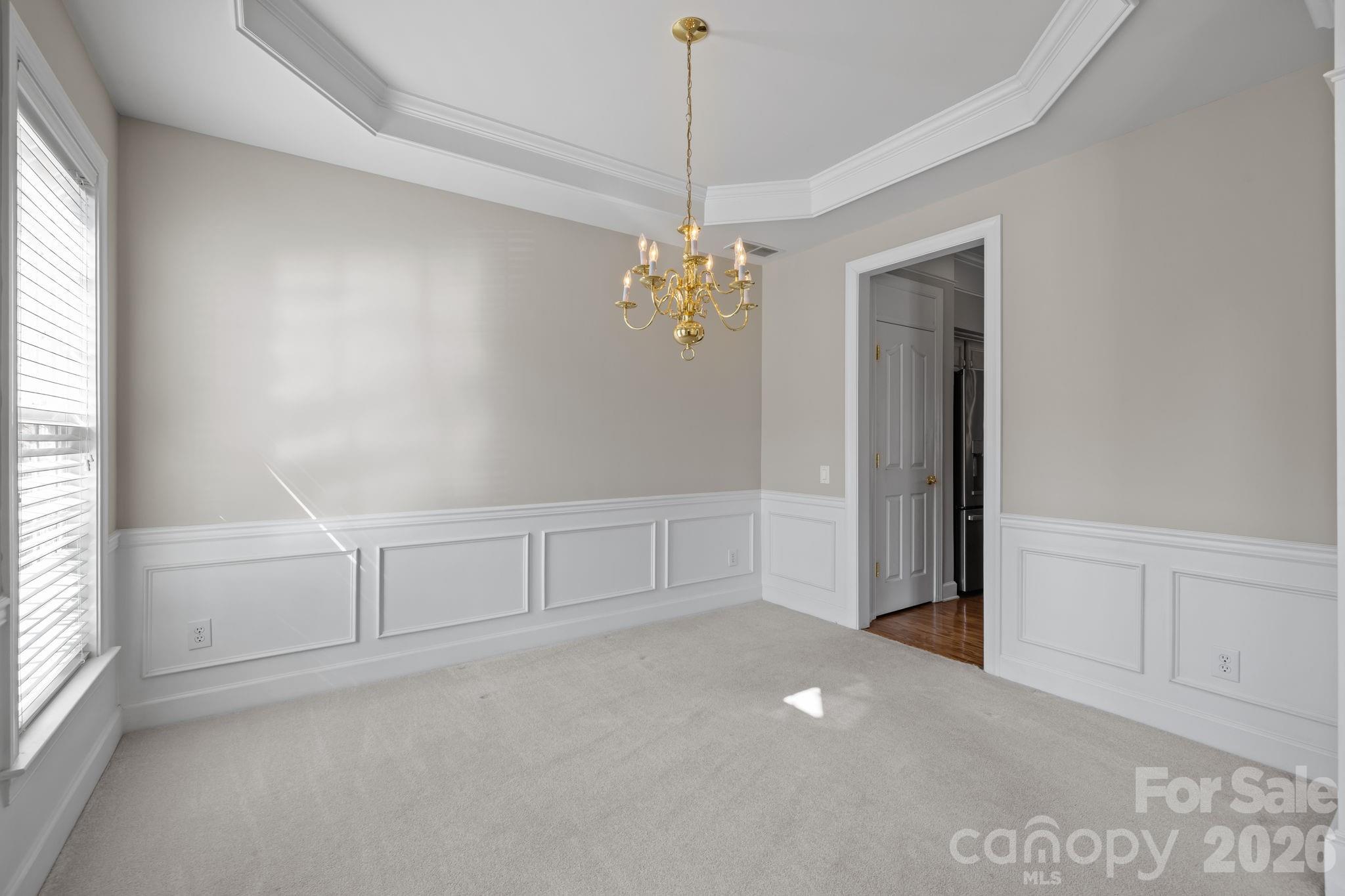 412 Eberle Way Matthews, NC 28105 - Photo 10 of 43 a view of a room with window and chandelier