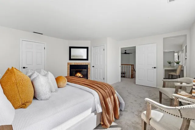 a bedroom with a bed and a couch