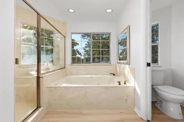 a bathroom with a bathtub and a shower