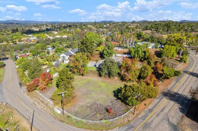 a view of a patio with chairs under an umbrella