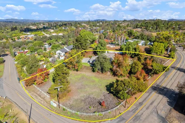 a spacious bathroom with a double vanity sink and a mirror