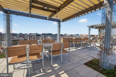 a view of a chairs and table in patio