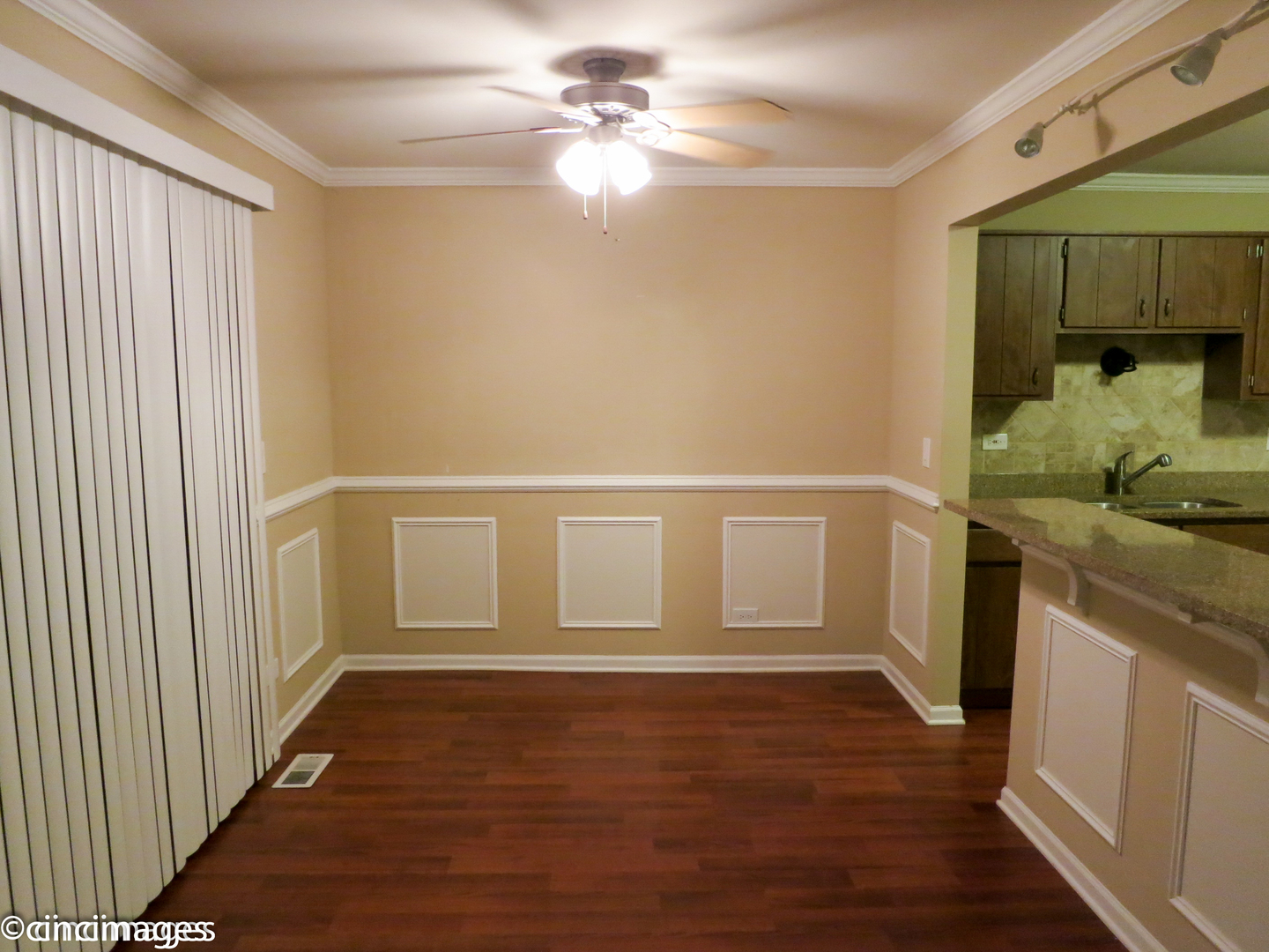 1548 7 Pines Road, Unit B1 Schaumburg, IL 60193 - Photo 3 of 11 a view of an empty room with window and wooden floor