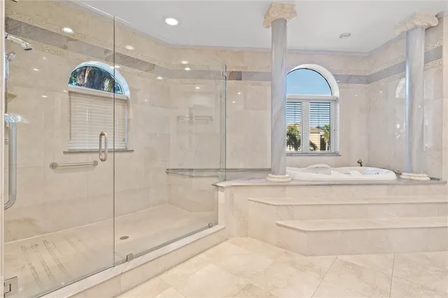 a living room with furniture or couch and a chandelier