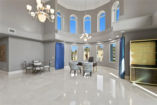 a large kitchen with granite countertop a sink a counter space appliances and cabinets