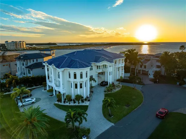 a view of a room with wooden floor and windows
