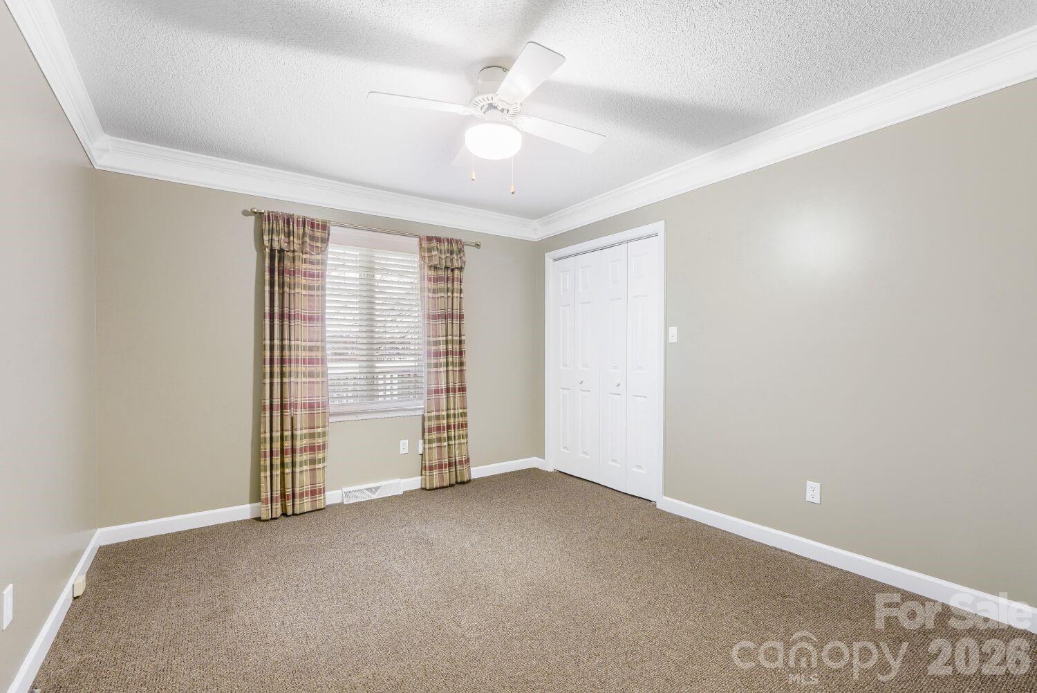 22527 John Gamble Road Cornelius, NC 28031 - Photo 16 of 33 an empty room with windows and fan