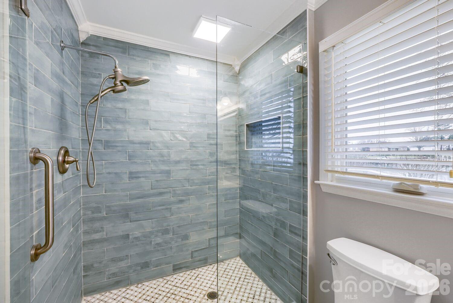 22527 John Gamble Road Cornelius, NC 28031 - Photo 19 of 33 a bathroom with a shower and a toilet