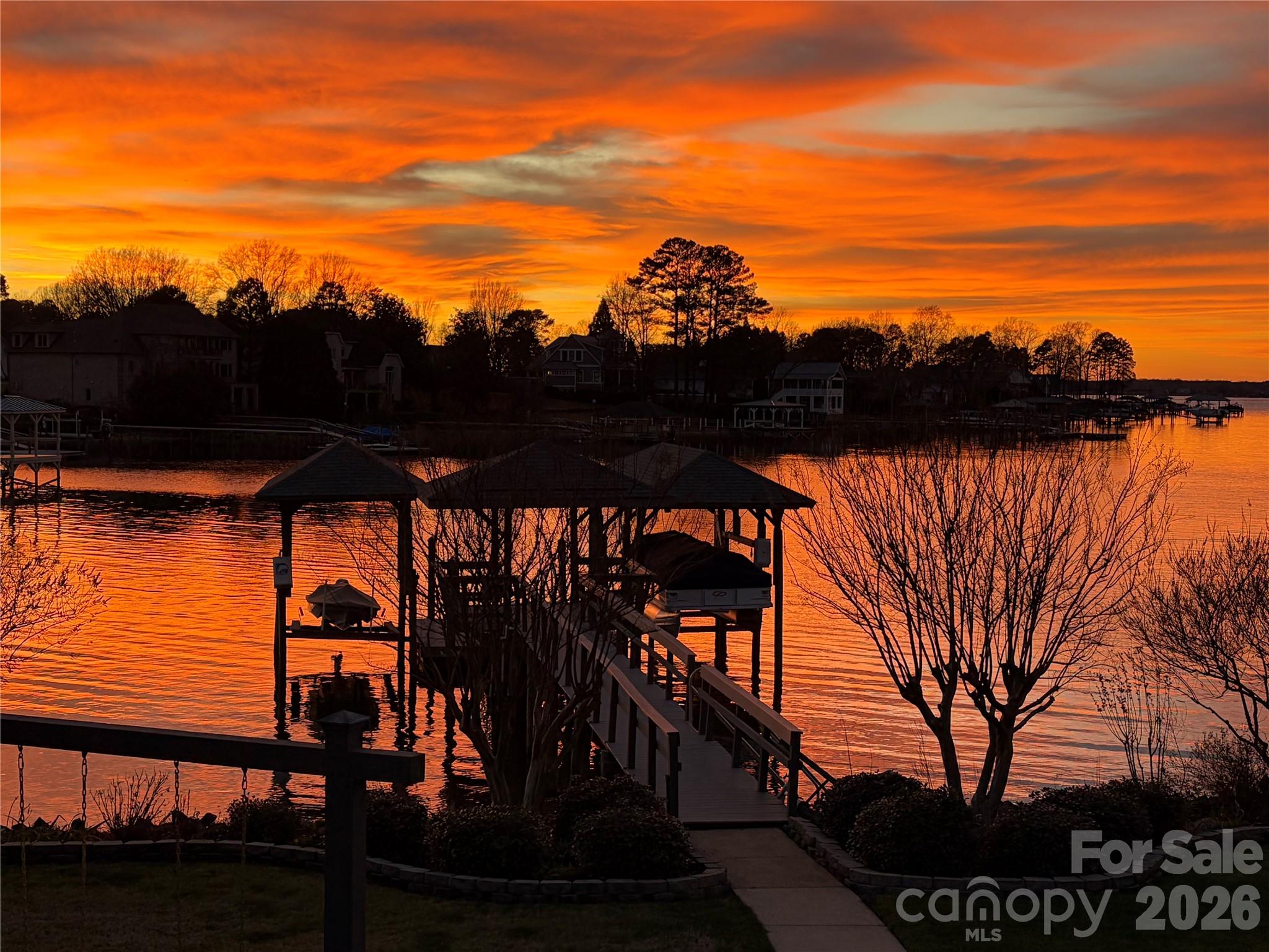 22527 John Gamble Road Cornelius, NC 28031 - Photo 2 of 33 a view of swimming pool from a lake