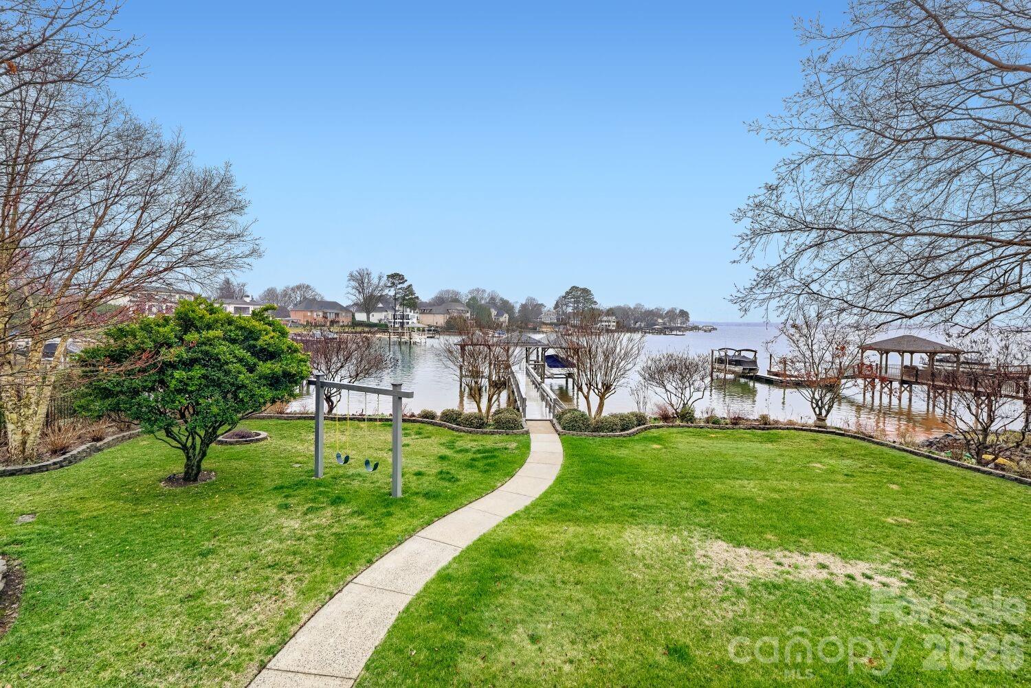 22527 John Gamble Road Cornelius, NC 28031 - Photo 28 of 33 a view of a garden with a building in the background