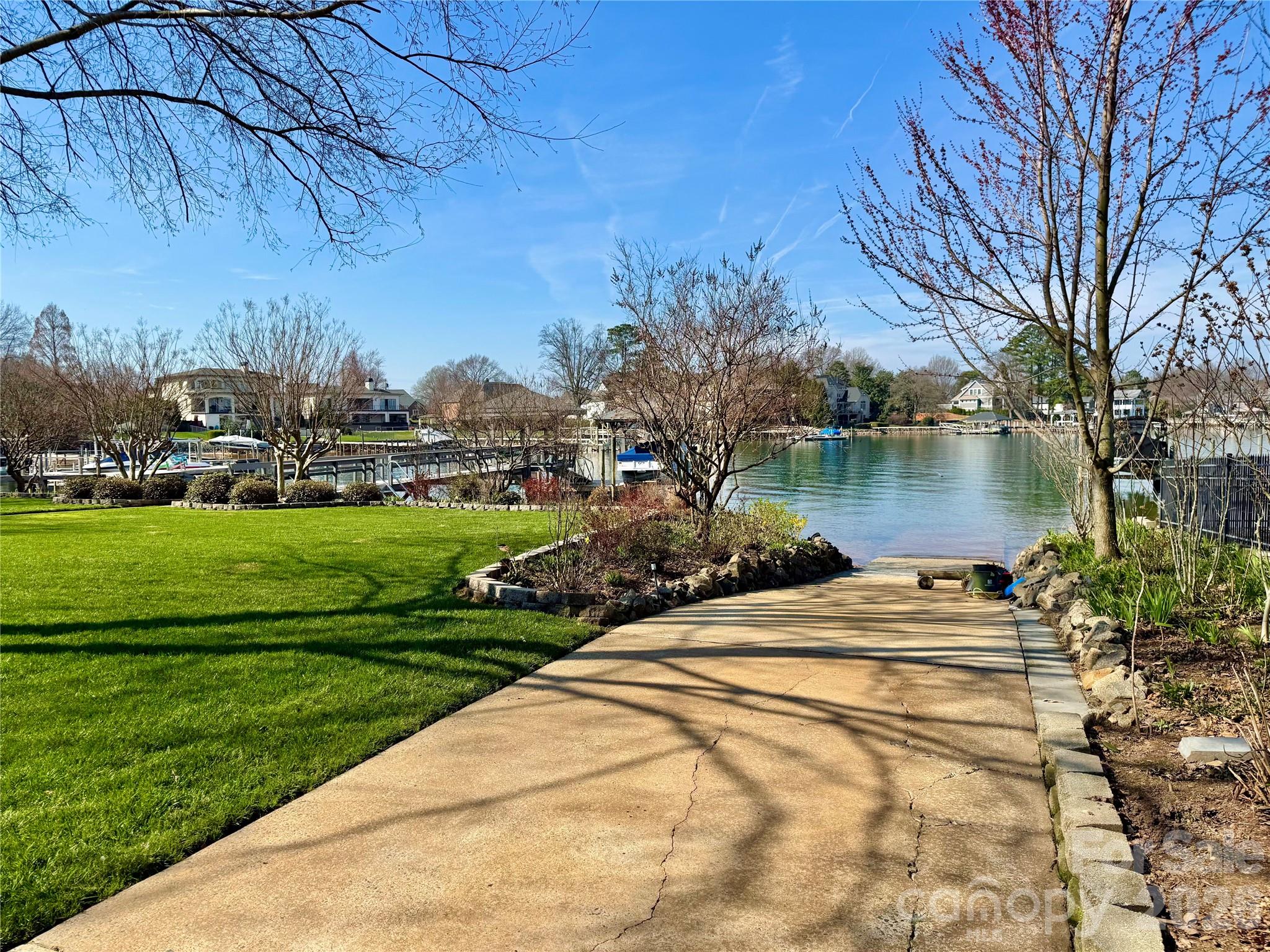 22527 John Gamble Road Cornelius, NC 28031 - Photo 30 of 33 a view of a lake with a house in the background