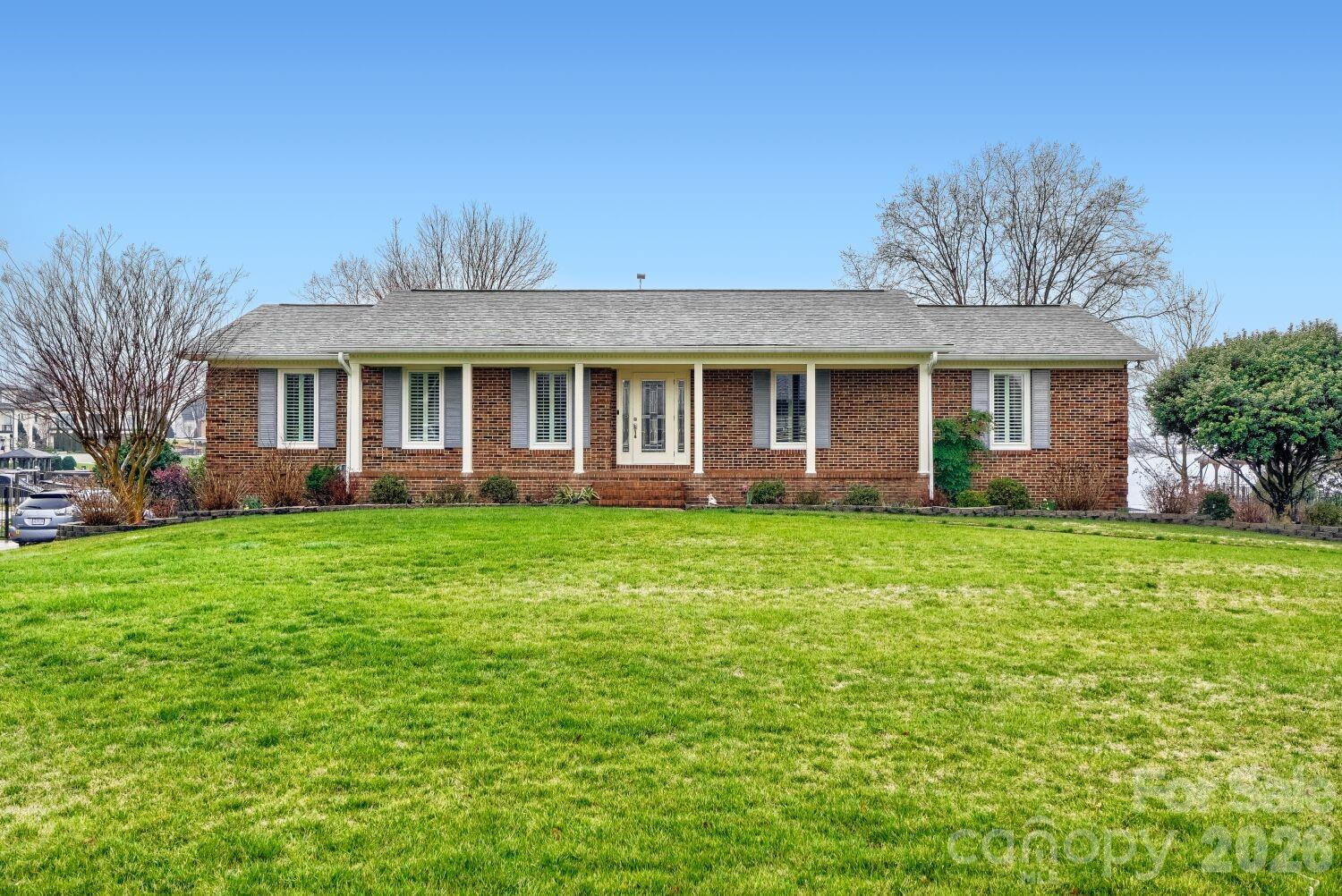 22527 John Gamble Road Cornelius, NC 28031 - Photo 4 of 33 a front view of a house with garden