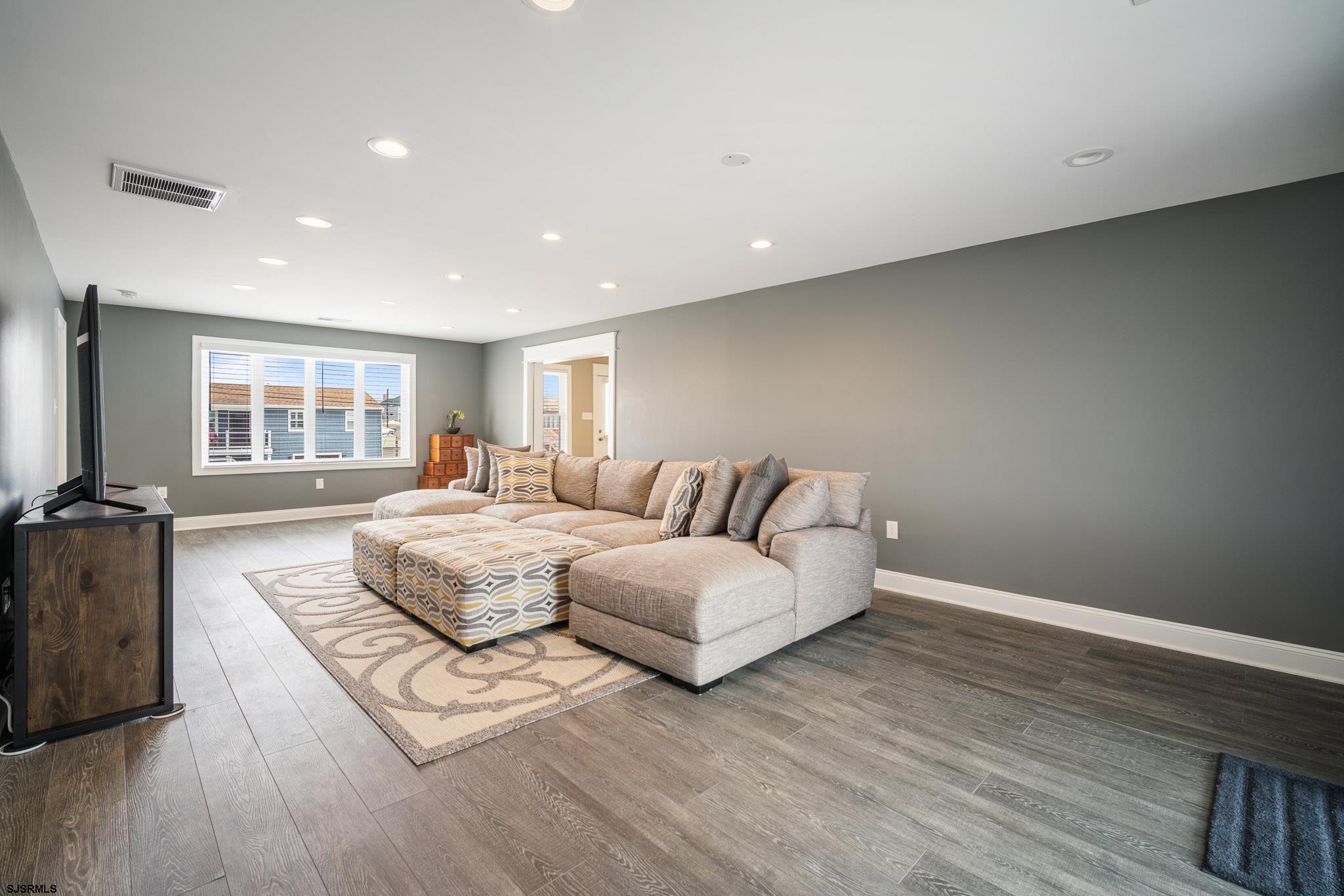 440 Hackney Place Brigantine, NJ 08203 - Photo 17 of 45 a living room with couches and a large window