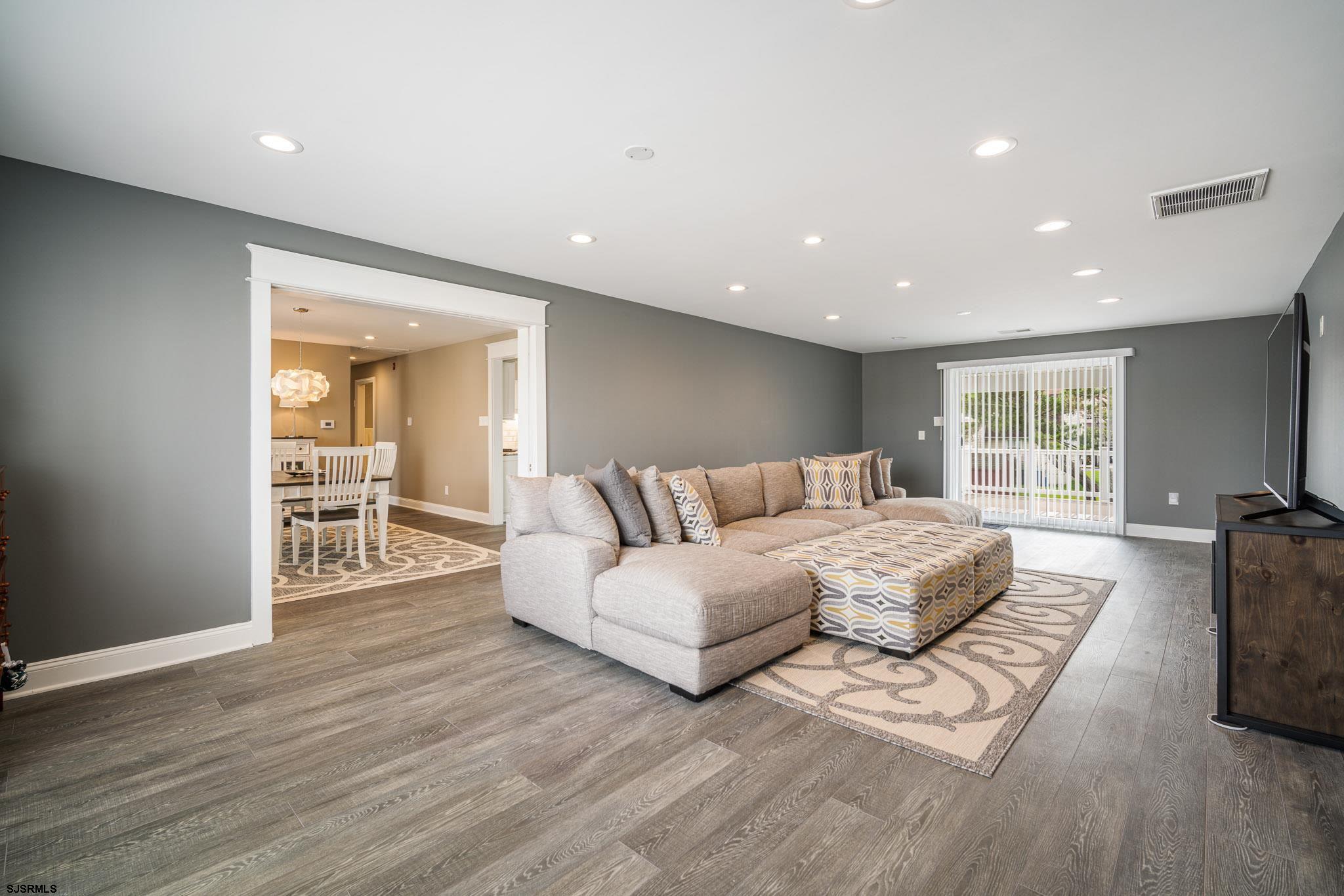440 Hackney Place Brigantine, NJ 08203 - Photo 18 of 45 a living room with furniture and a wooden floor