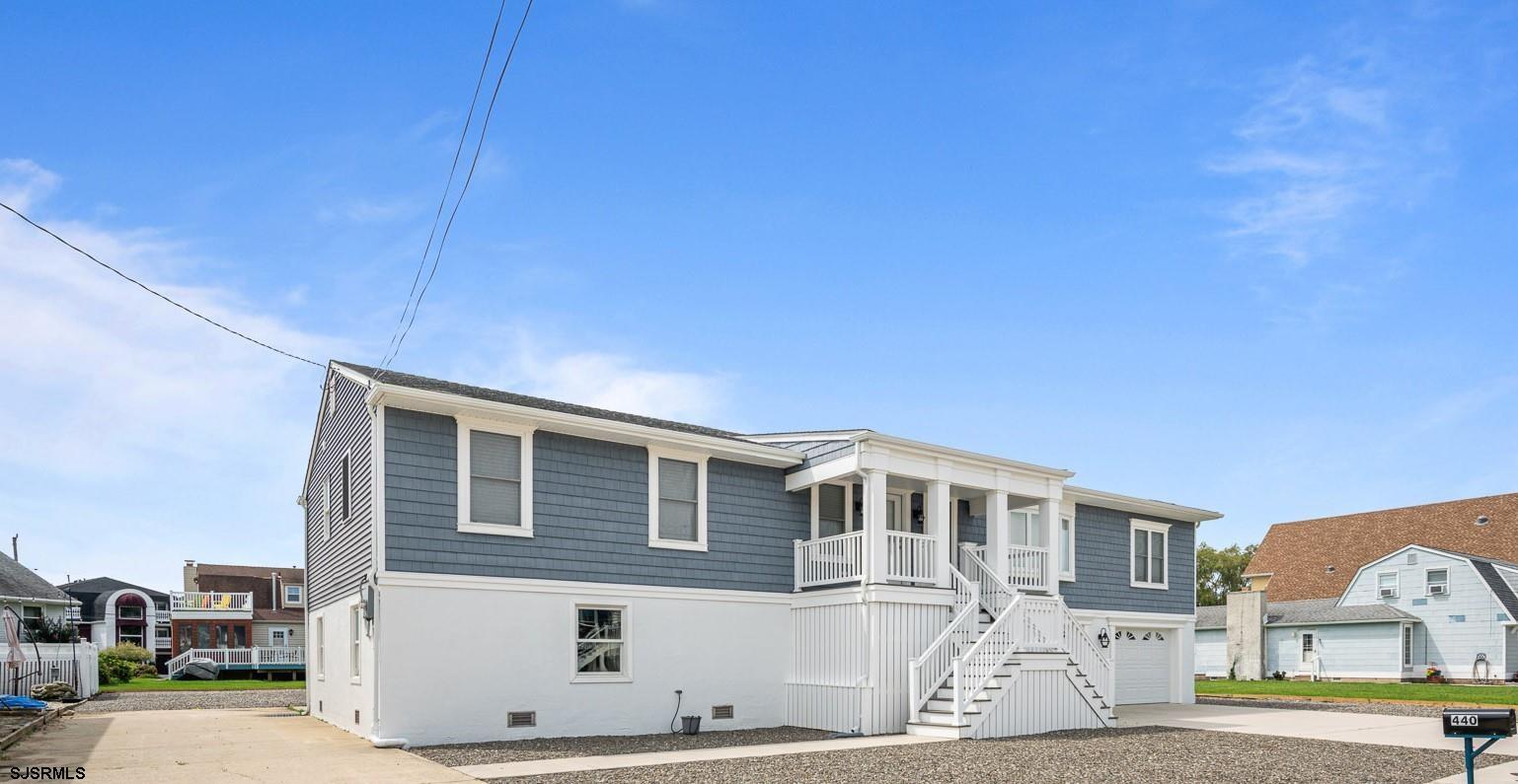440 Hackney Place Brigantine, NJ 08203 - Photo 2 of 45 a front view of a house with a yard