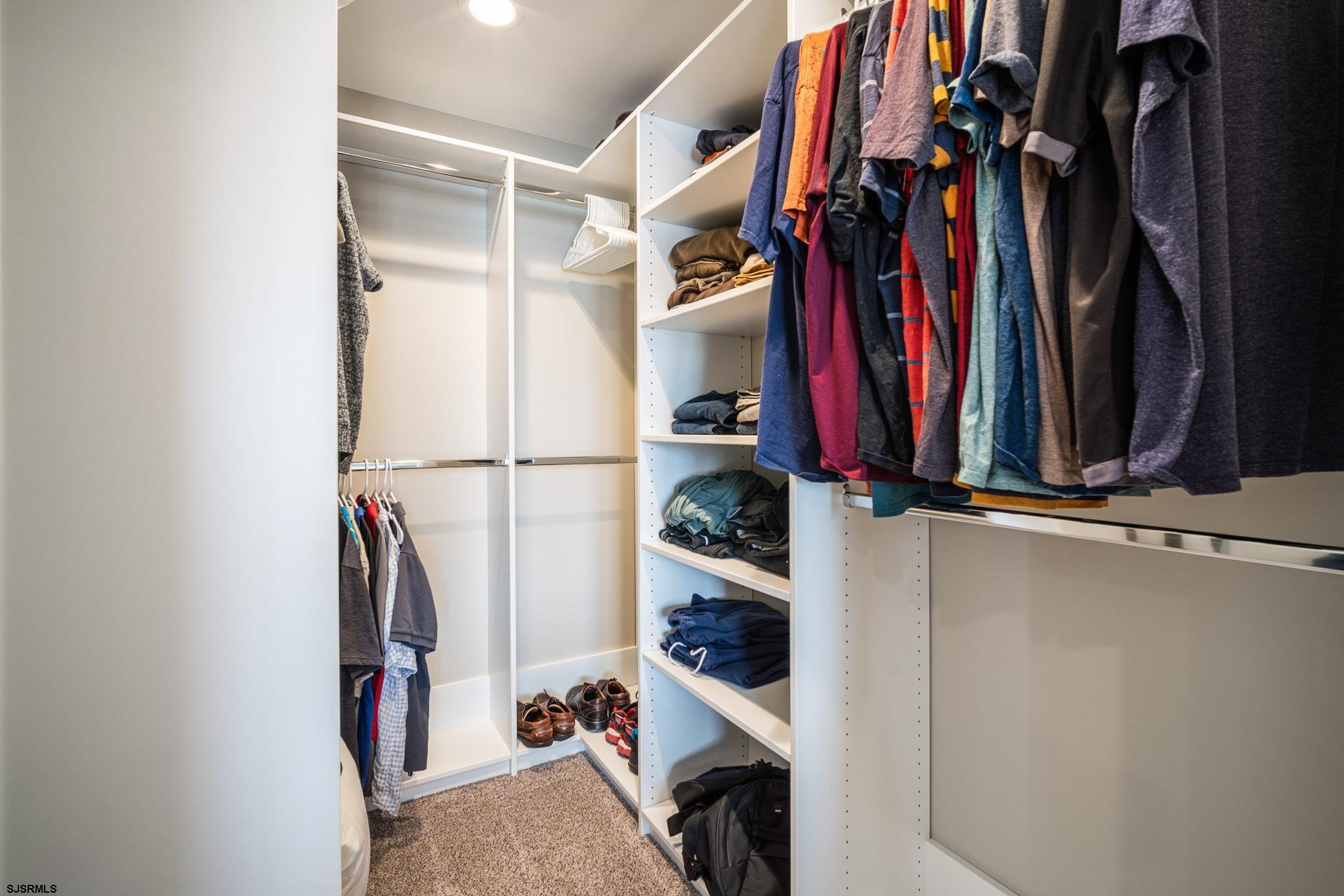 440 Hackney Place Brigantine, NJ 08203 - Photo 29 of 45 a view of walk in closet with clothes and shoes