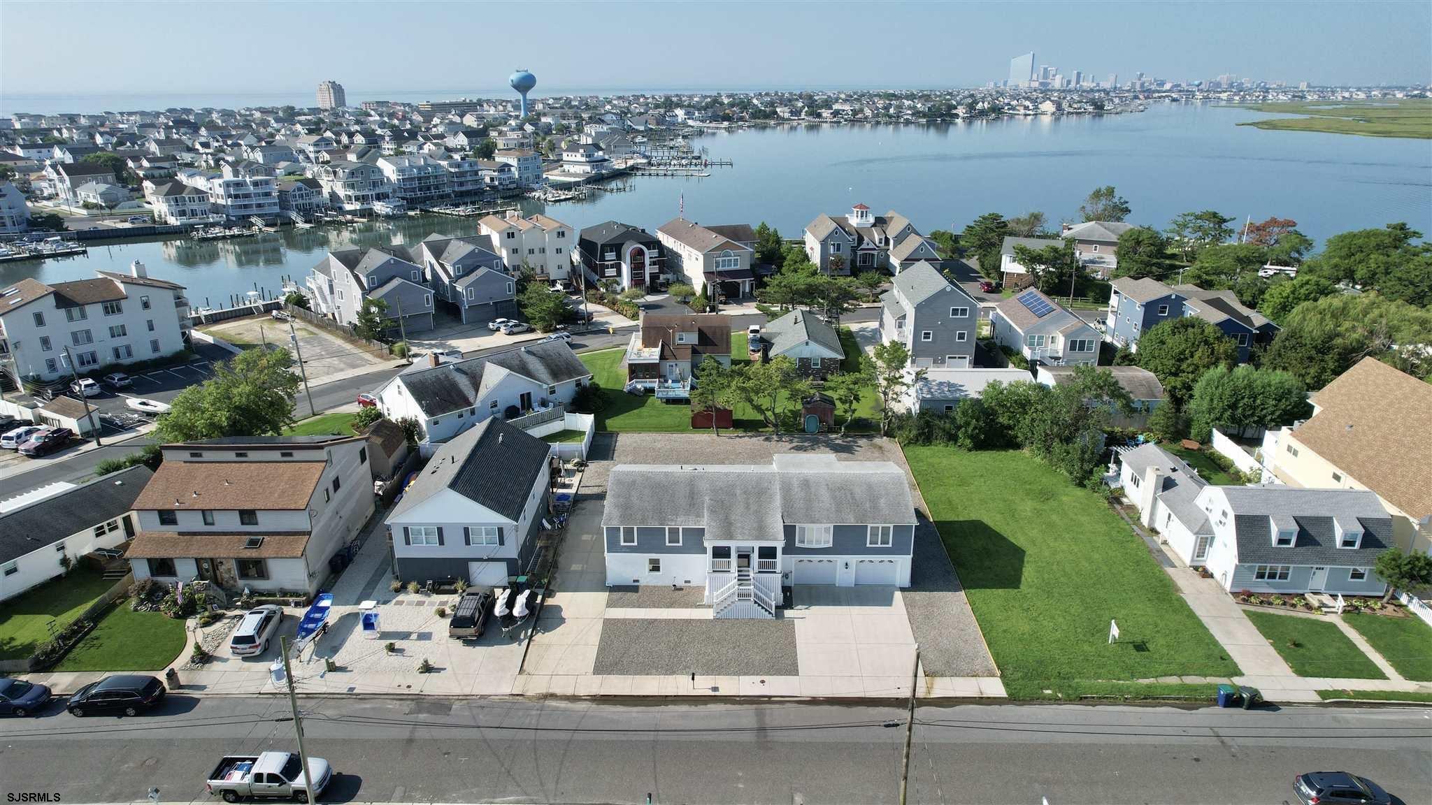 440 Hackney Place Brigantine, NJ 08203 - Photo 3 of 45 an aerial view of a house with outdoor space and lake view