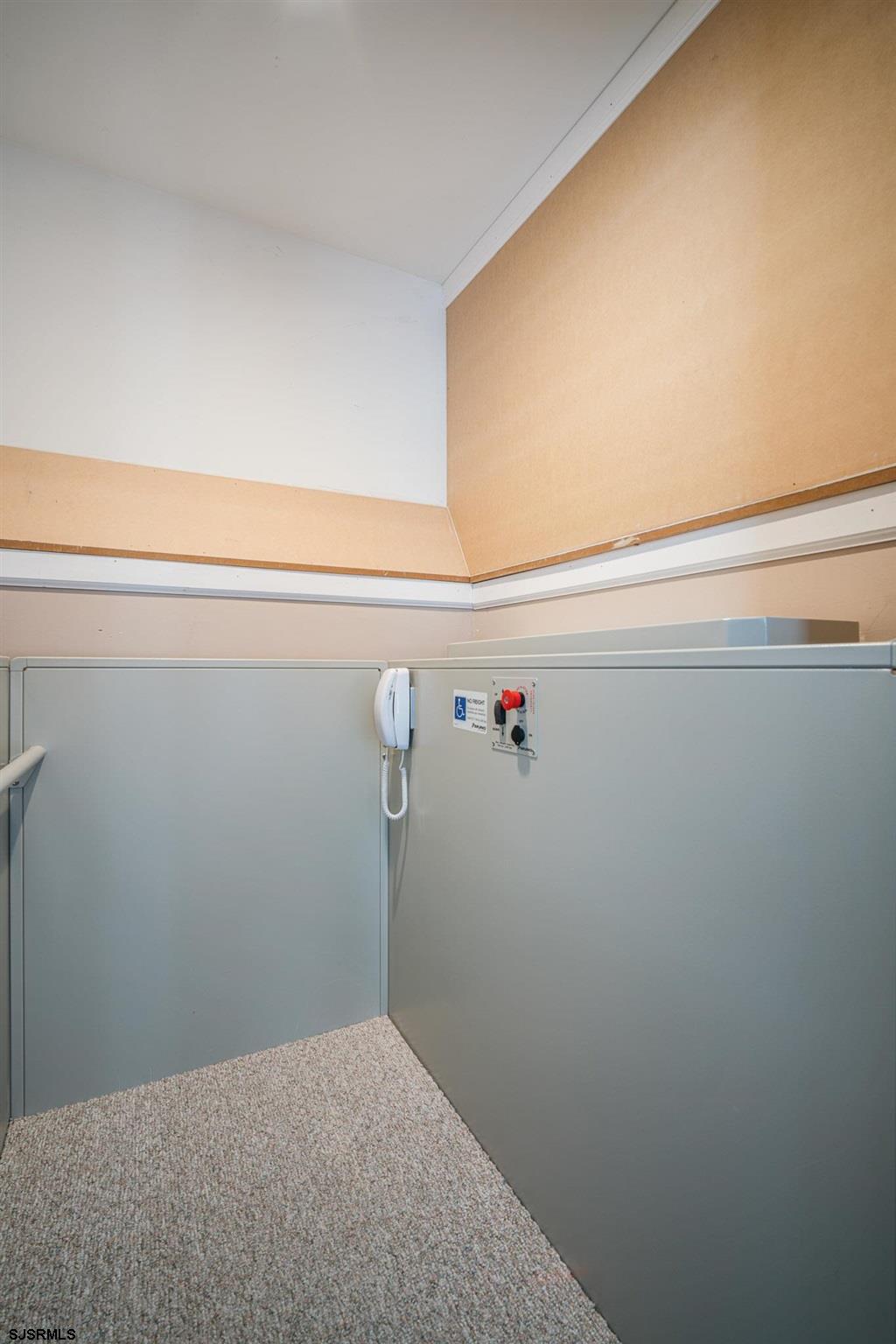 440 Hackney Place Brigantine, NJ 08203 - Photo 37 of 45 a view of a room with racks on the wall