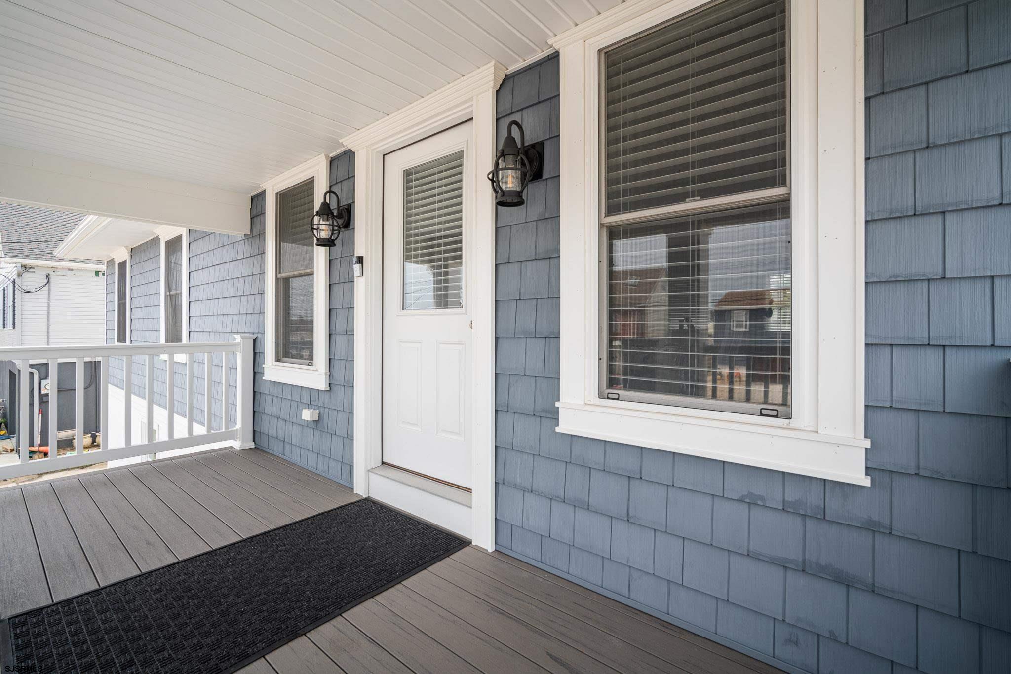440 Hackney Place Brigantine, NJ 08203 - Photo 5 of 45 a view of an empty room with wooden floor and a window