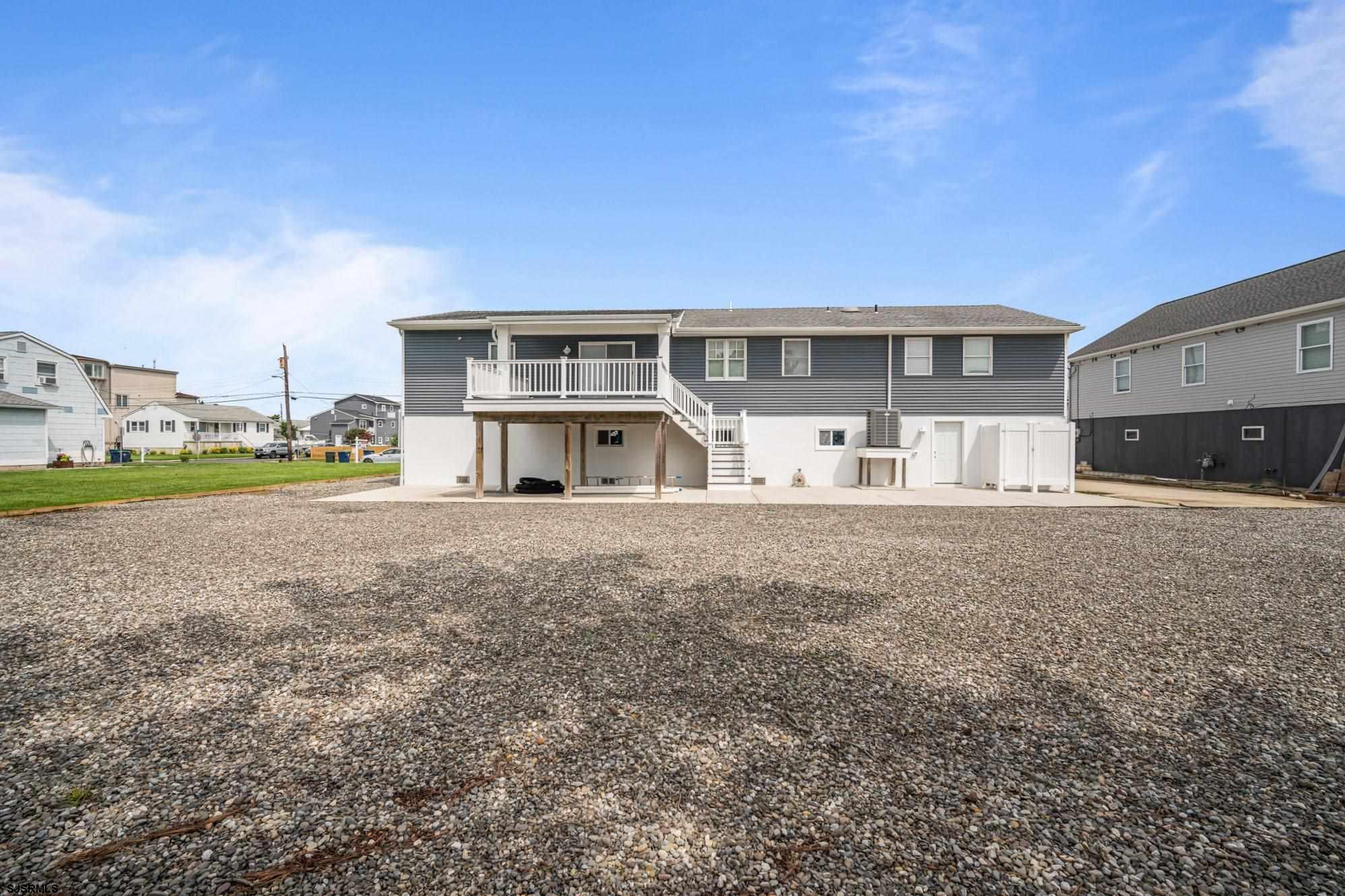 440 Hackney Place Brigantine, NJ 08203 - Photo 8 of 45 a view of a house with a yard and sitting area