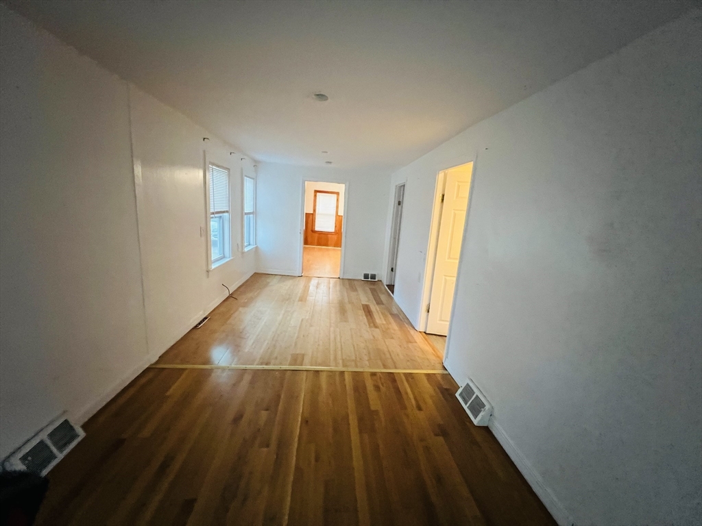 61 East Main Street Brockton, MA 02301 - Photo 12 of 20 a view of a room with wooden floor and window