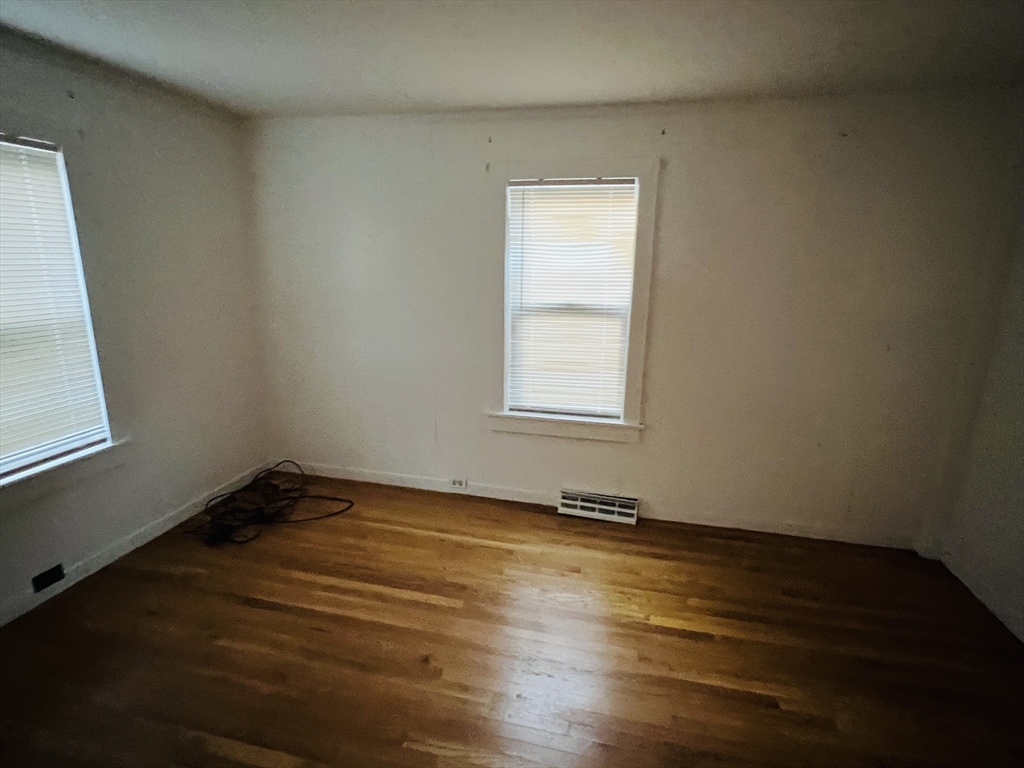 61 East Main Street Brockton, MA 02301 - Photo 20 of 20 a view of a room with wooden floor and window