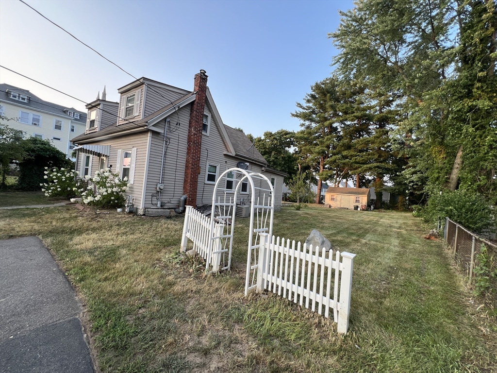 61 East Main Street Brockton, MA 02301 - Photo 3 of 20 a front view of a house with garden