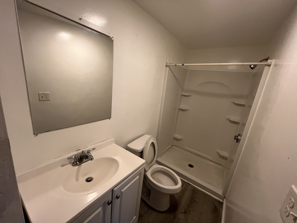61 East Main Street Brockton, MA 02301 - Photo 10 of 20 a bathroom with a sink toilet and shower