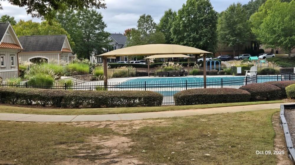 4363 Grove Field Park Northwest Suwanee, GA 30024 - Photo 16 of 18 a view of a street with houses