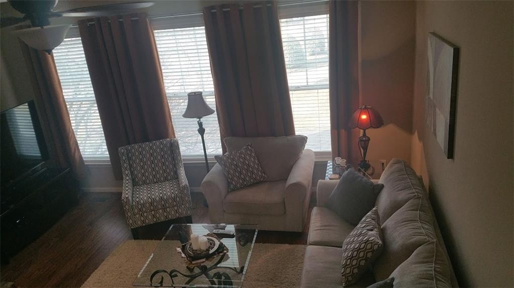 4363 Grove Field Park Northwest Suwanee, GA 30024 - Photo 6 of 18 a living room with furniture and a window