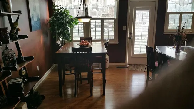 a kitchen with stainless steel appliances granite countertop a refrigerator a stove top oven a sink and dishwasher