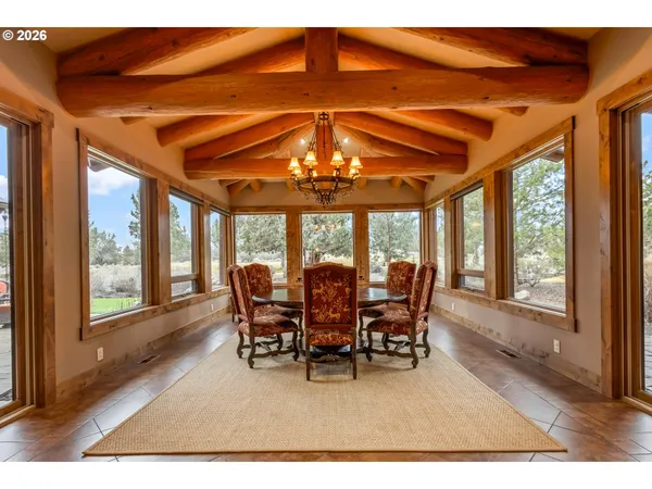 a view of a dining room with furniture window and outside view