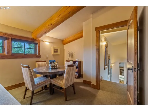 a dining room with furniture and window