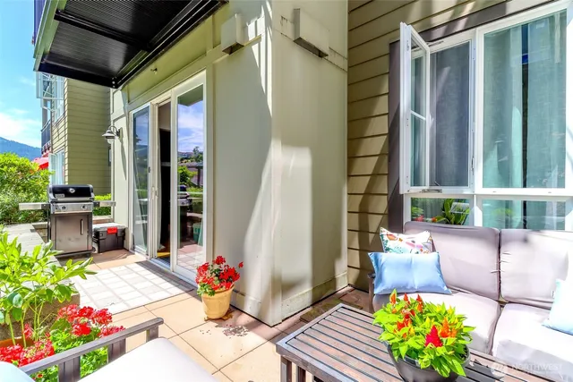 a front view of a house with outdoor seating