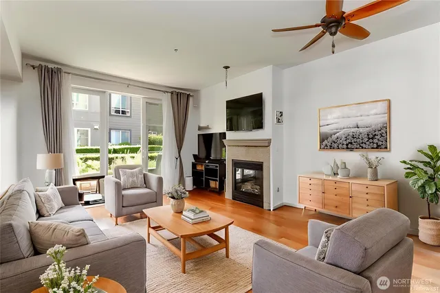 a kitchen with a sink cabinets and wooden floor