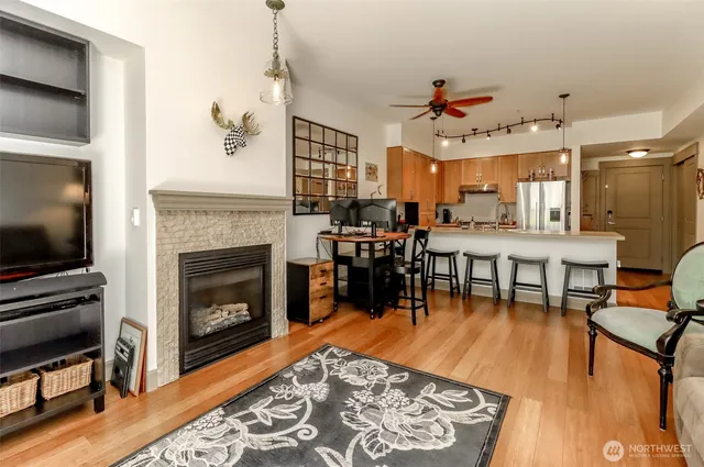 a kitchen with stainless steel appliances a sink stove and wooden cabinets