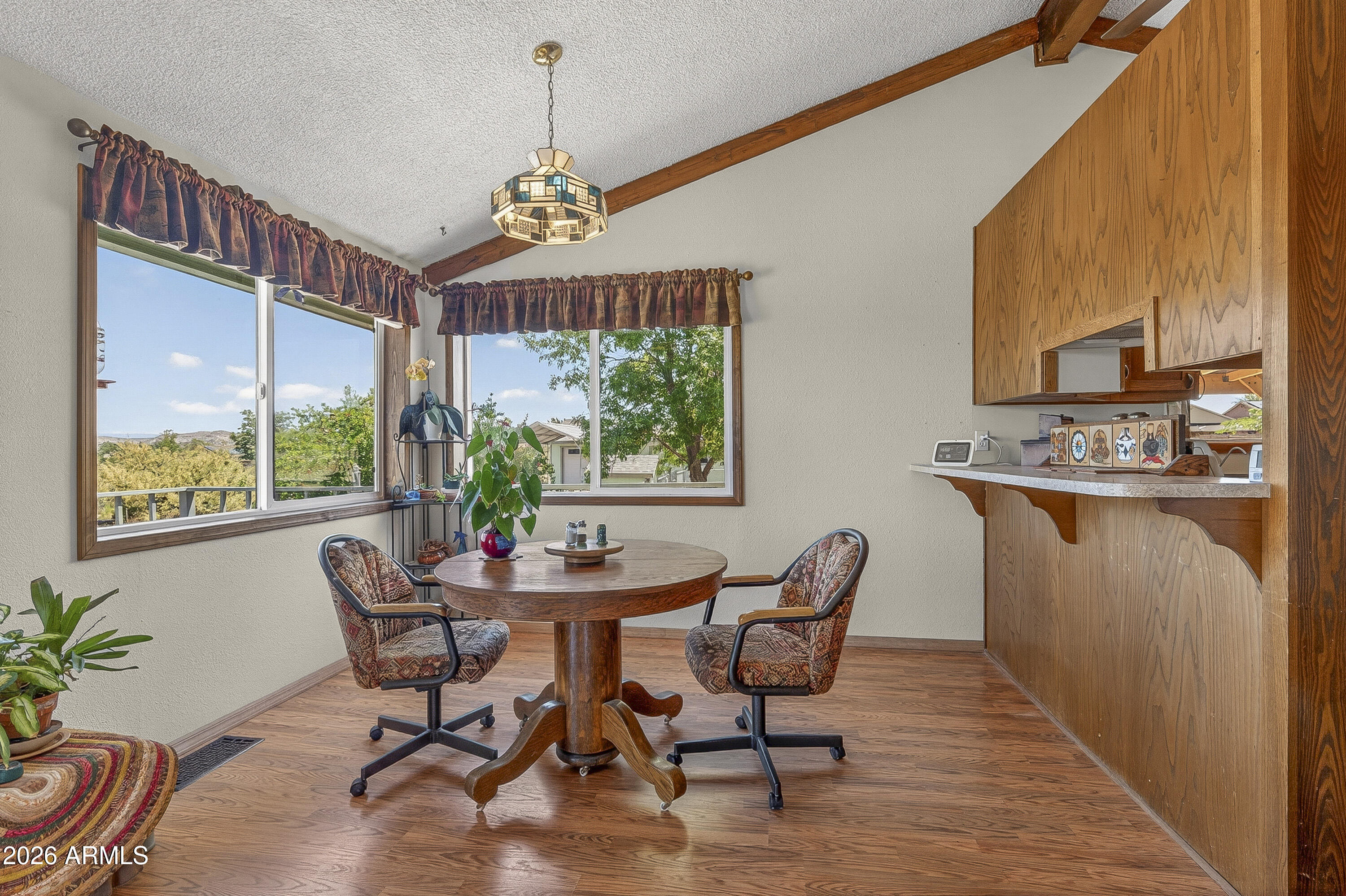 633 Oasis Road Camp Verde, AZ 86322 - Photo 46 of 50 a dining room with furniture mountain view and wooden floor