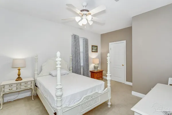 a bed room with a bed and a chandelier