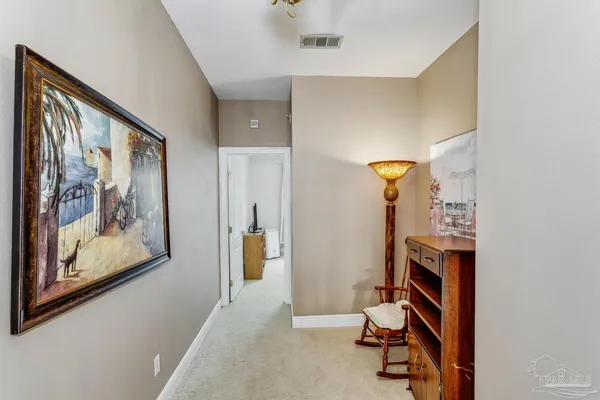 a view of a hallway with workspace
