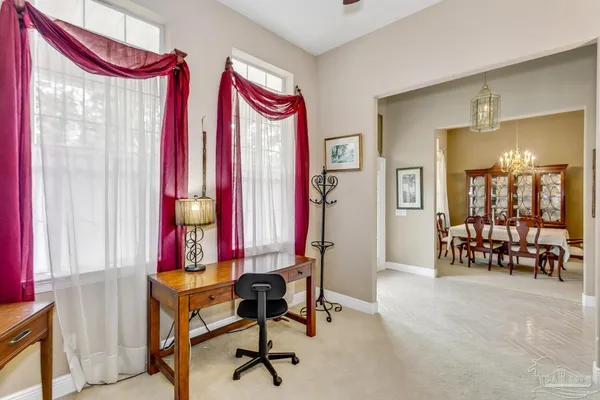 a view of a room with furniture and a window