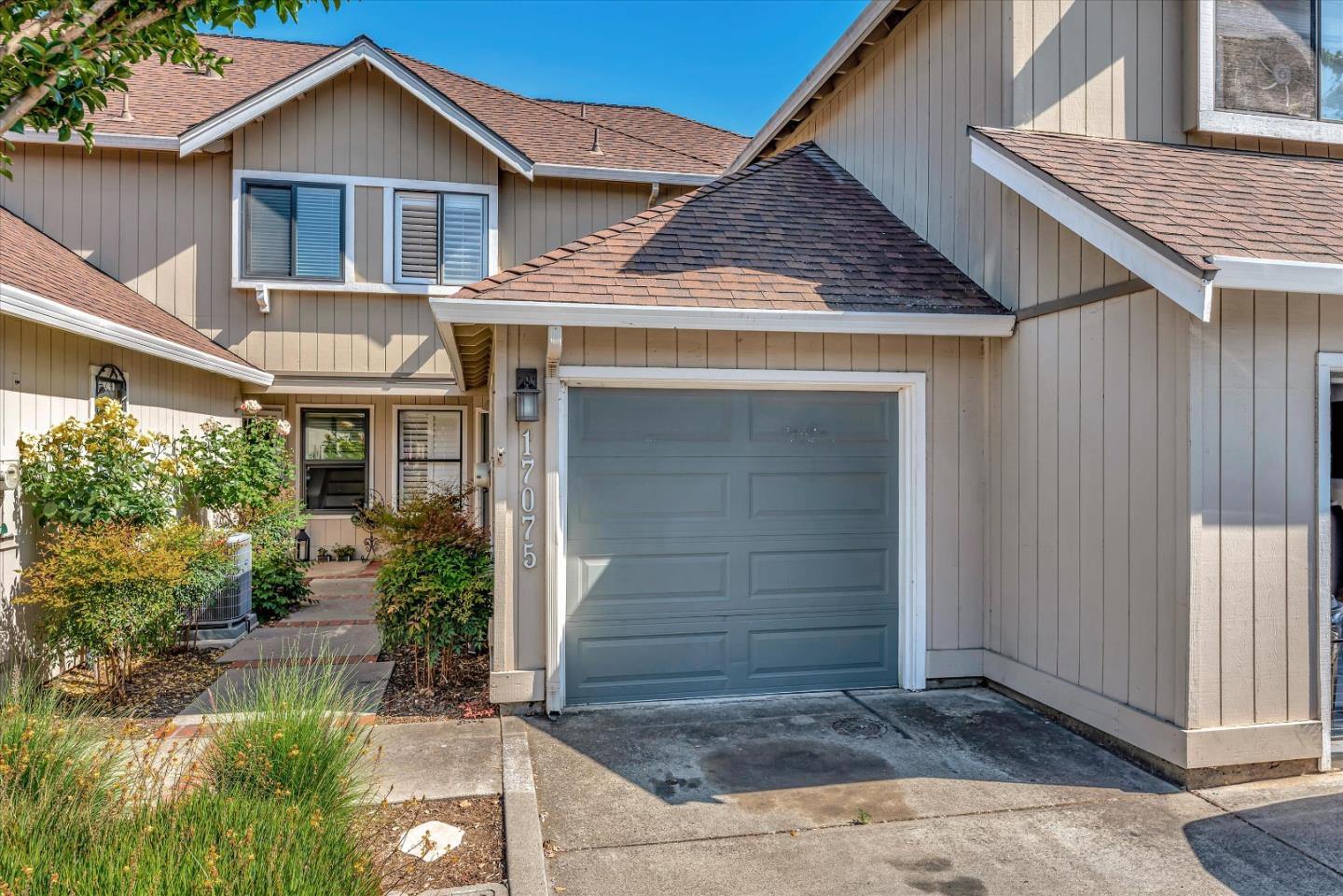 17075 Creekside Circle Morgan Hill, CA 95037 - Photo 1 of 49 a view of a house with small yard plants and large tree