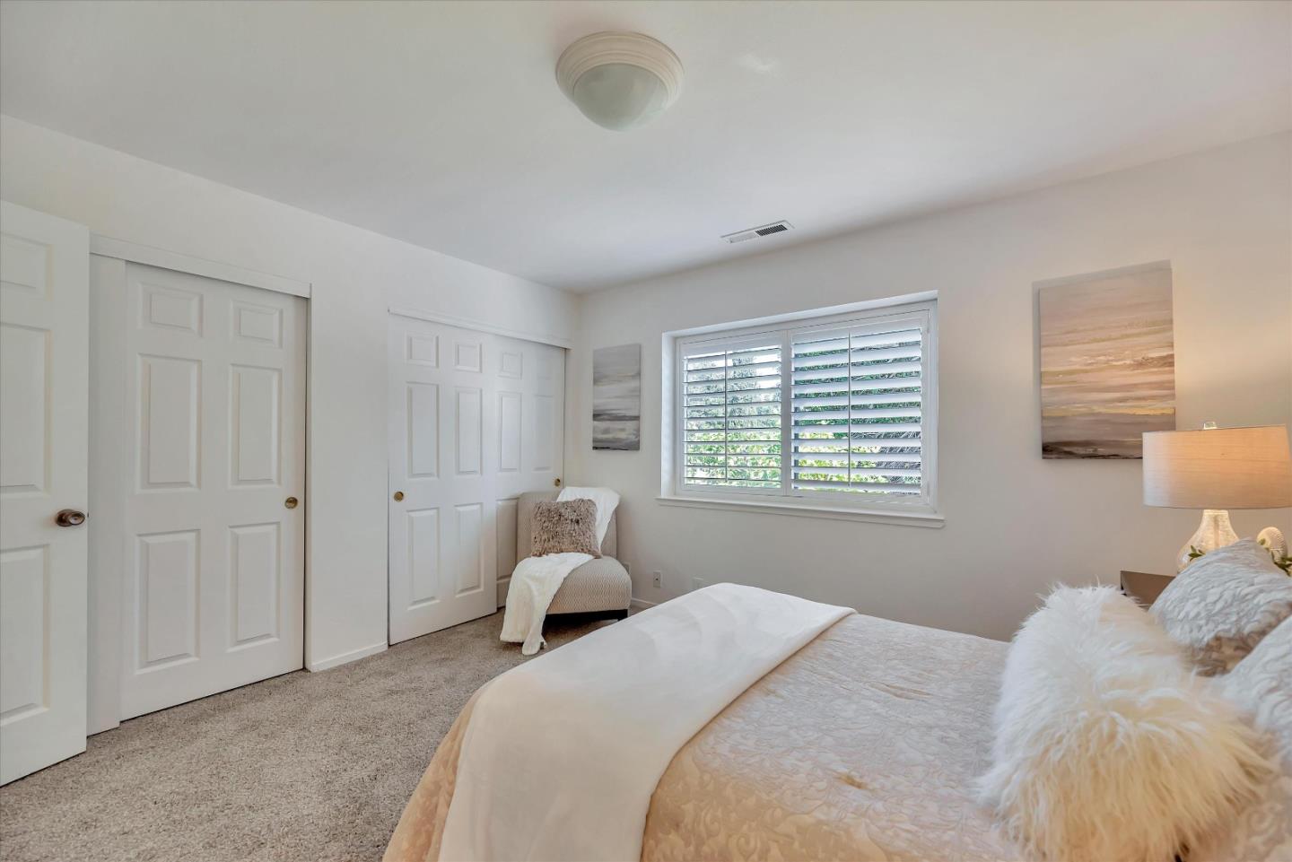 17075 Creekside Circle Morgan Hill, CA 95037 - Photo 19 of 49 a bedroom with a bed and a large window